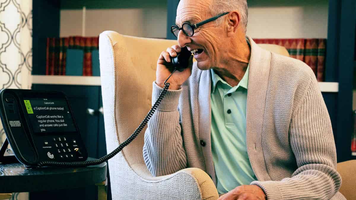 Captioned telephones let a person listen to the other party and read captions of what they are saying, using a dedicated captioned phone or connected device. Photo courtesy of CaptionCall.
