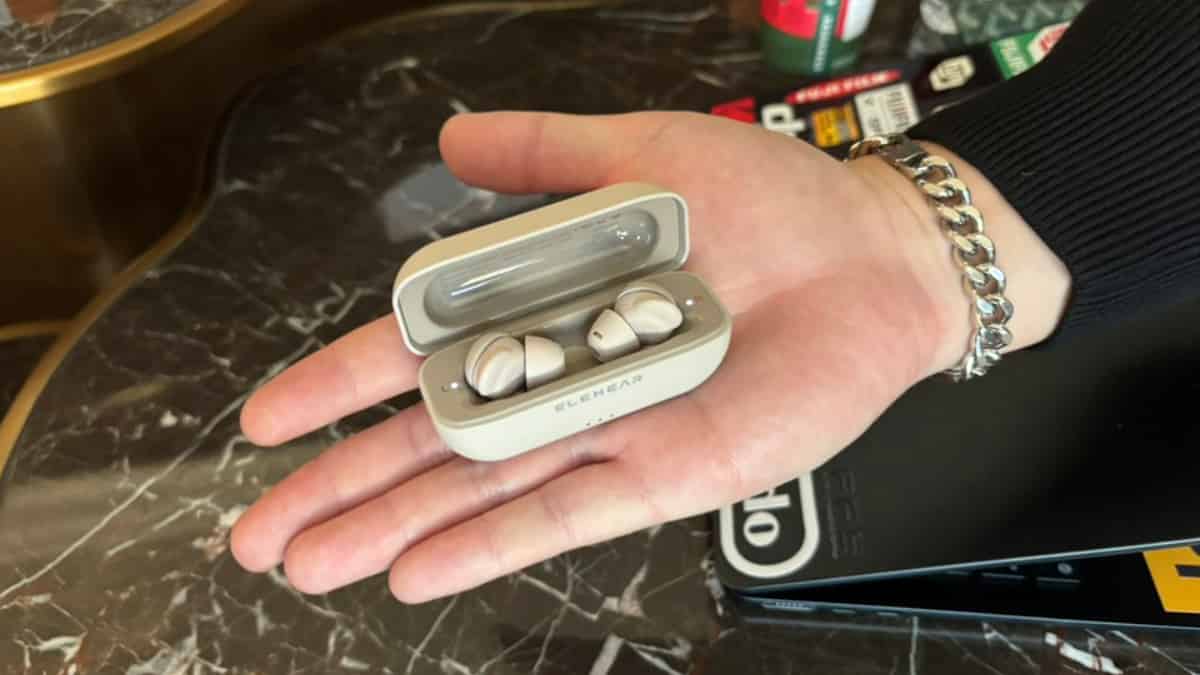 Elehear's VP of Sales Jeffery Teng reveals the new Elehear Delight OTC hearing aid in its palm-sized charging/carrying case that also stores two full charges.