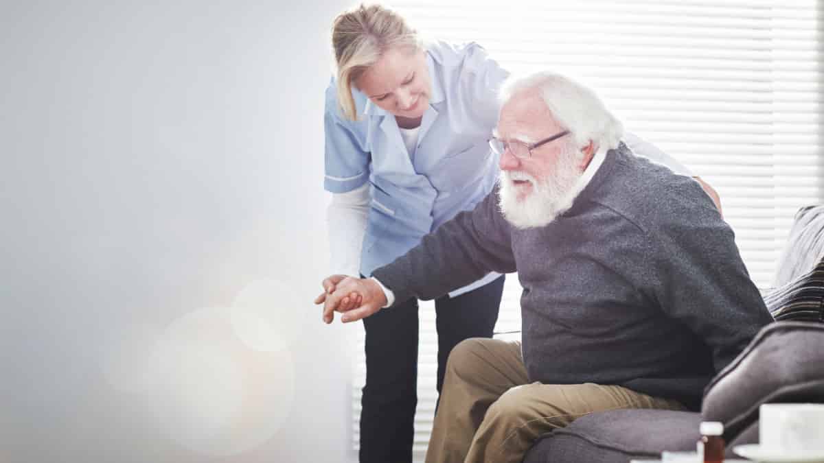 Older Man With Assistant Senior